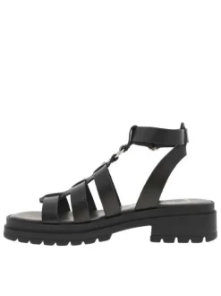 Sandales noires avec des sangles à talon décroché moyen et à boucle à ardillon