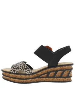 Sandales noires et léopards à talon compensé haut et avec une grande boucle