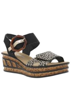 Sandales noires et léopards à talon compensé haut et avec une grande boucle