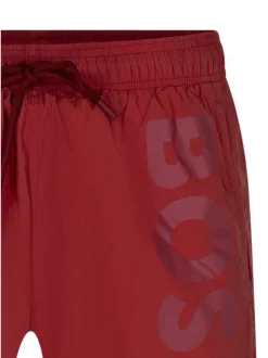 Short de bain en rouge uni avec une coupe droite et 2 poches raglan