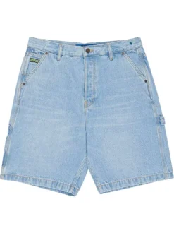 Short en coton bleu uni pourvu d'une coupe baggy et de multiples poches
