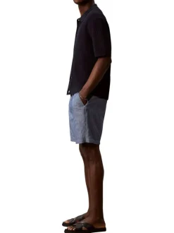 Short en coton bleu uni pourvu d'une taille élastiquée et d'une coupe droite