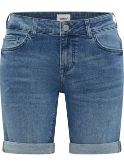 Short en coton mélangé indigo uni avec une coupe slim à zip et à bouton