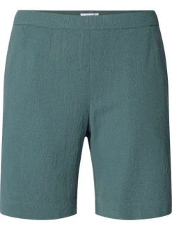 Short en coton vert uni pourvu d'une taille élastiquée et d'une coupe droite