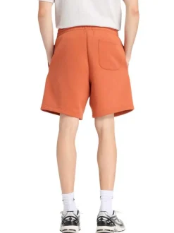 Short jogging orange uni avec une coupe droite et une taille élastique