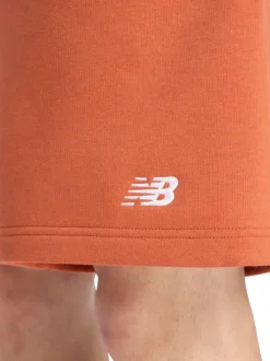 Short jogging orange uni avec une coupe droite et une taille élastique