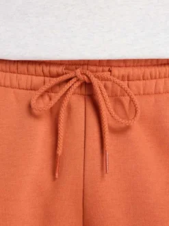Short jogging orange uni avec une coupe droite et une taille élastique