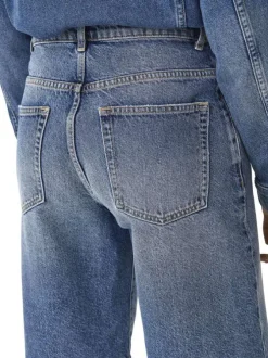 Short long en coton bleu uni avec une coupe large à zip et à bouton