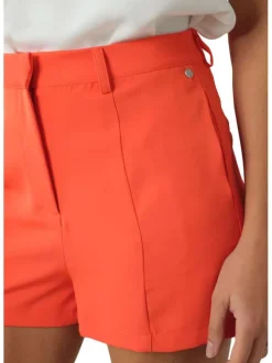 Short orange uni avec une coupe courte une forme chino et une taille haute