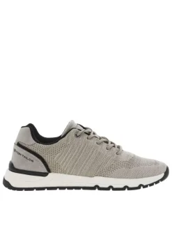 Sneakers beiges en maille avec des détails noirs et à lacets ronds