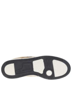 Sneakers camel avec des détails beiges et bleus marine à semelle plate