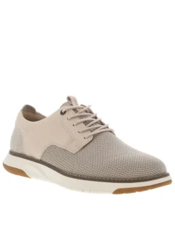 Sneakers en cuir beiges avec le bout et le talon en maille et à lacets ronds