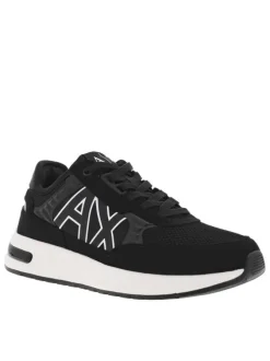 Sneakers monochromes noires à doublure néoprène, semelle semi-compensée blanche