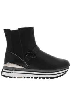 Sneakers montantes en cuir brillant noir à semelle running compensée et soufflets élastiqués
