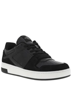 Sneakers tennis en cuir noir à semelle blanche semi-compensée et lacets plats