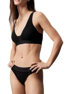 String noir en dentelle zébrée avec une ceinture élastiquée large