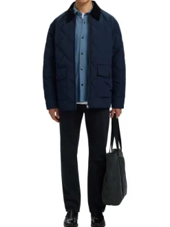 Surchemise marine uni avec un col boutonné et des manches longues