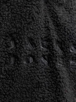 Sweat noir uni en sherpa avec une coupe droite et un col à capuche
