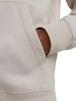 Sweat à capuche beige uni avec une coupe droite et une poche kangourou