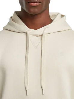 Sweat à capuche blanc uni avec une coupe droite et une poche kangourou