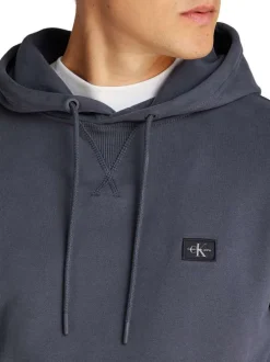 Sweat à capuche en coton bleu marine uni à coupe droite avec un petit patch