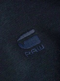 Sweat à capuche marine uni avec une poche kangourou et une coupe droite