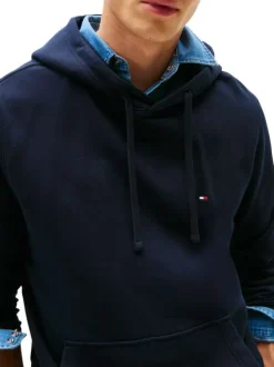 Sweat en coton marine pourvu d'un col à capuche avec cordons de serrage