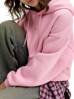 Sweat en coton rose pourvu d'un coupe droite et d'un col à capuche
