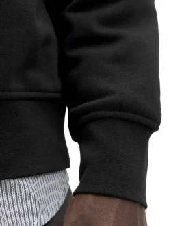 Sweat à manches longues noir uni avec un col camionneur et une coupe droite