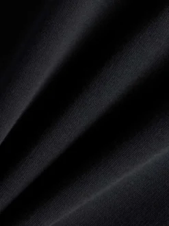 Sweat noir imprimé logo avec une coupe droite et un col rond