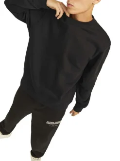 Sweat noir uni avec une coupe droite un col rond et des manches longues