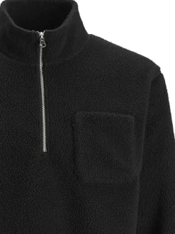 Sweat noir uni en sherpa avec des manches longues et un col camionneur