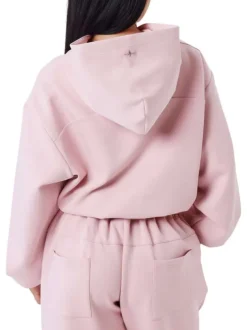 Sweat rose uni avec une coupe cropped à capuche et à manches longues