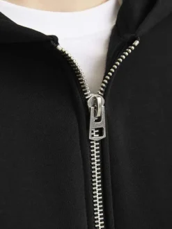 Sweat zippé noir uni avec une coupe droite et un col à capuche