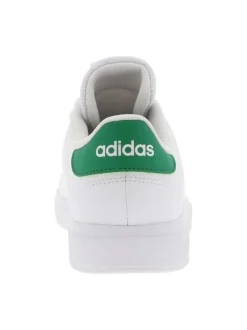 Tennis blanches et vertes à talon plat avec lacets plats et logo perforé