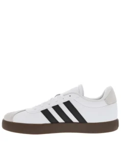 Tennis en cuir blanches à semelle marron foncé avec logos noirs