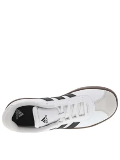 Tennis en cuir blanches à semelle marron foncé avec logos noirs
