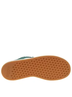 Tennis en cuir vertes à semelle écrue et maron avec lacets plats et logo blanc