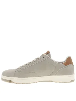 Tennis beiges à semelle plate avec une fermeture à lacets et zip latéral