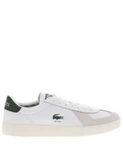 Tennis blanches avec des détails verts à semelle plate et à lacets plats