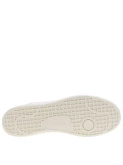 Tennis blanches avec des détails verts à semelle plate et à lacets plats