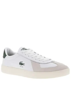 Tennis blanches avec des détails verts à semelle plate et à lacets plats