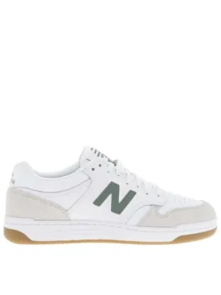 Tennis blanches à détails verts avec des lacets plats tressés