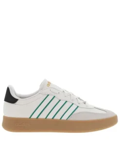 Tennis blanches et vertes en cuir à semelle marron avec logo jaune et lacets
