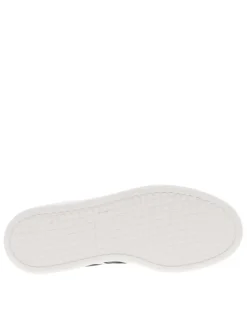 Tennis en cuir blanches avec semelle à talon plat et fermeture à lacets