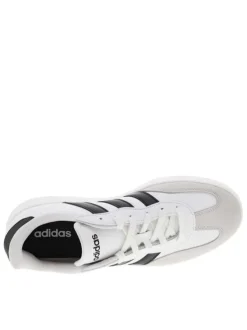 Tennis en cuir blanches avec semelle à talon plat et fermeture à lacets