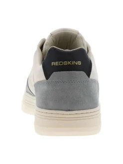 Tennis en cuir blanches et bleues à semelle translucide avec logos dorés