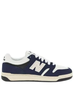 Tennis en cuir blanches et bleu marine avec semelle plate et lacets tressés