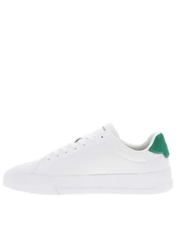 Tennis en cuir blanches et vertes à talon plat avec des lacets