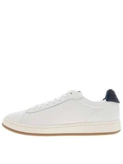 Tennis en cuir écrues à talon plat avec des lacets et un revêtement en grains